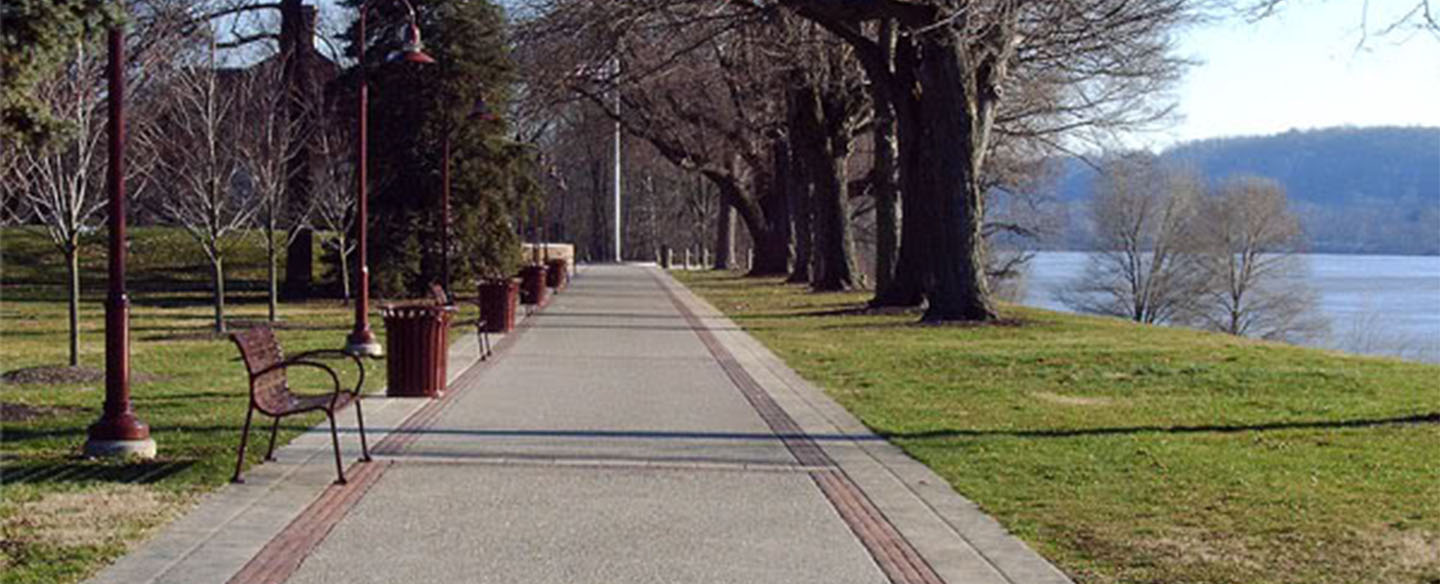 Benches Along Paved Walking Path At Fernbank Park
