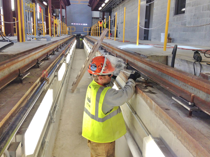 Installing rail in narrow maintenance pit