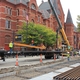 MPD workers unload the first shipment of rail to install it along Elm Street.