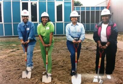 Workers with shovels and hard hats